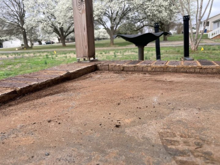 Concrete slab dropped below a brick step before leveling